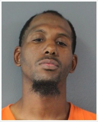 Booking photo of the man police identified as Dennis Earl, listed by the jail as Johnathan Earl Thomas